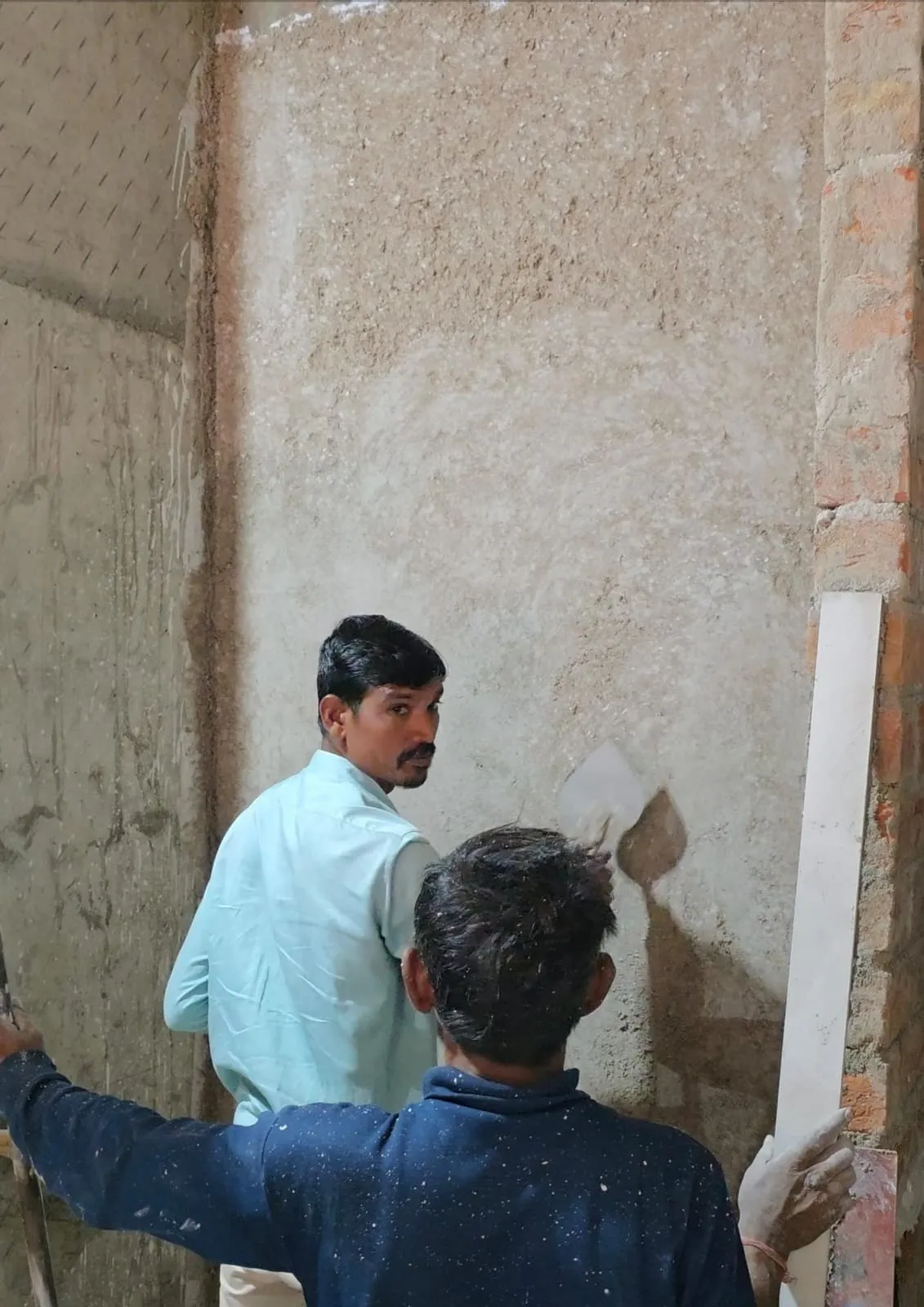 Lime plaster finish on a wall — smooth texture with warm natural tones